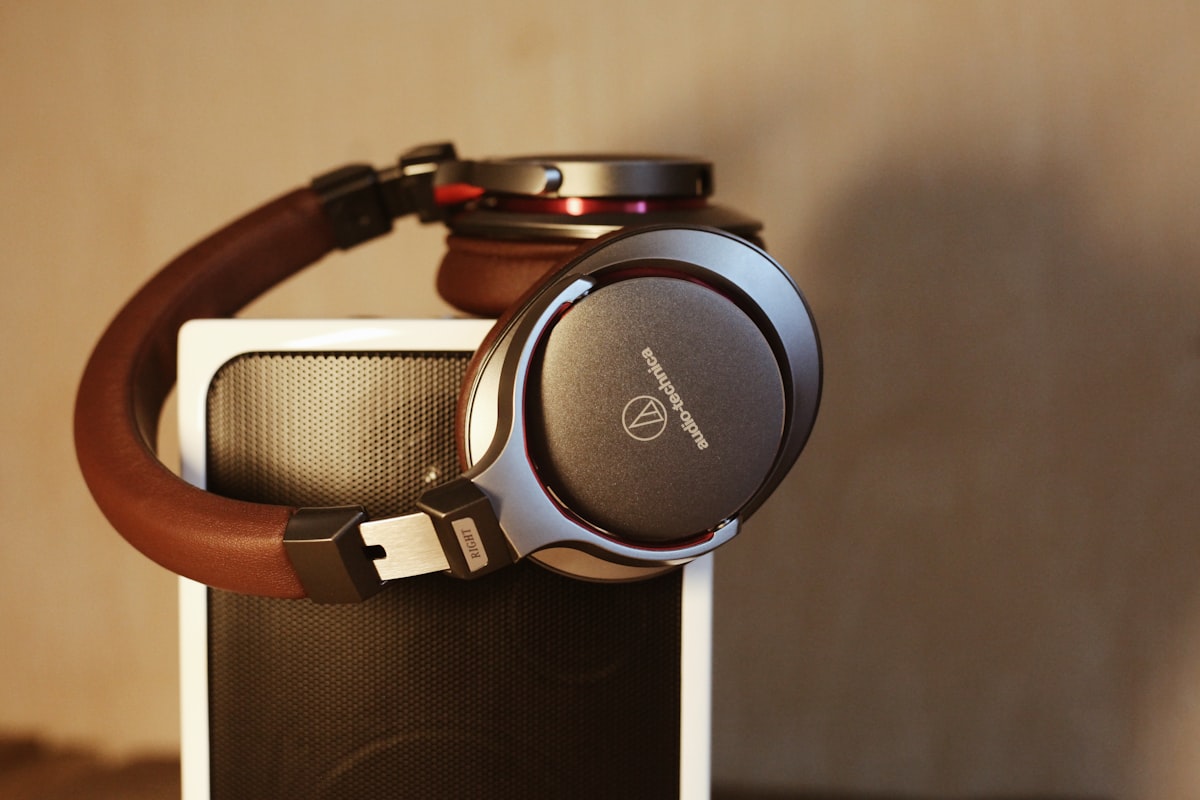Over-ear headphones and a portable speaker